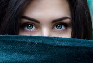 a close up of a person with blue eyes